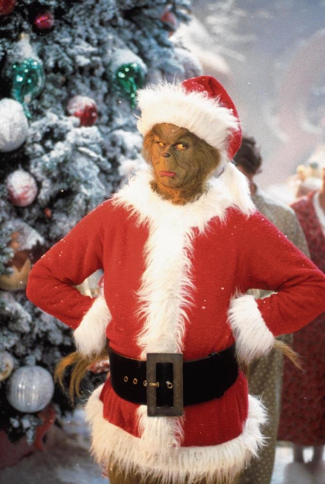 381271 01: Jim Carrey Stars As The Grinch, The Green Monster Who Disguises Himself As Santa Claus And Burglarizes Every Single House In The Village Of Whoville On Christmas Eve In The Live-Action Adaptation Of The Famous Christmas Tale, "Dr. Seuss' How The Grinch Stole Christmas," Directed By Ron Howard.  (Photo By Getty Images)
