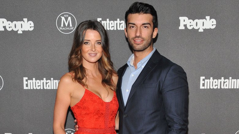 Emily and Justin Baldoni posing together at an event.