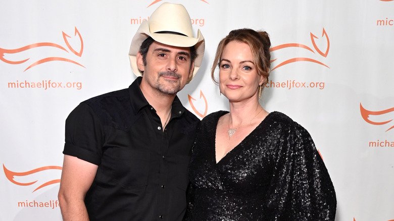 Kimberly and Brad Paisley posing together in black