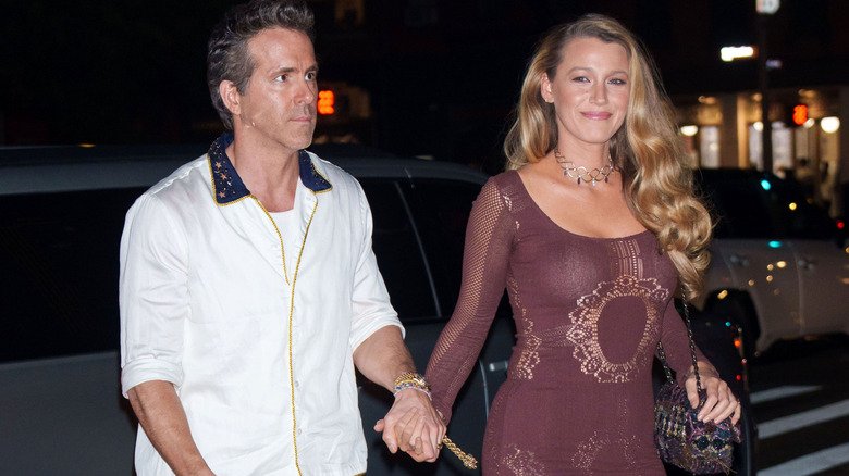 Ryan Reynolds and Blake Lively holding hands