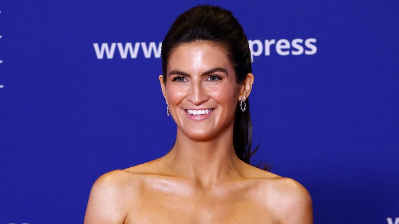Kaitlan Collins smiling for the press at the WHCD