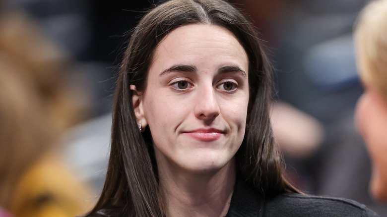 Caitlin Clark watching women's basketball