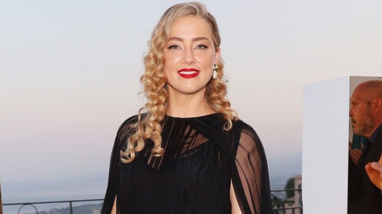 Amber Heard wearing a black dress