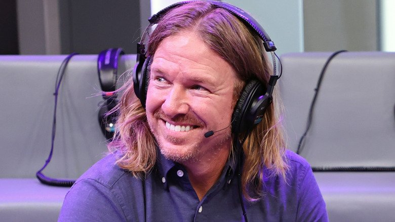 Chip Gaines smiles on a radio show wearing a headset