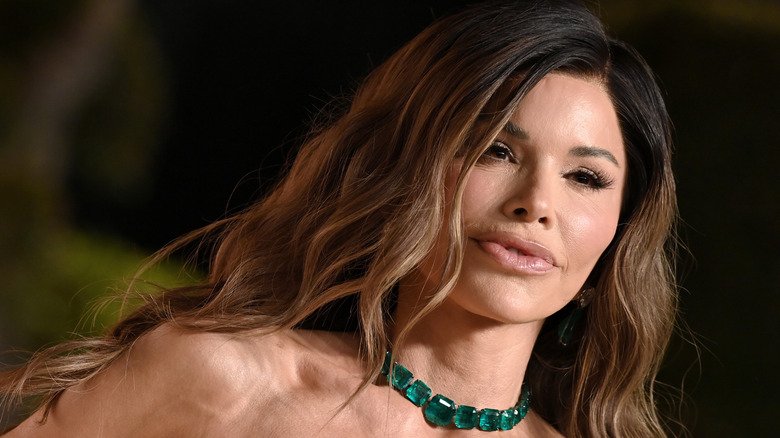 Lauren Sanchez posing on red carpet with lips pursed