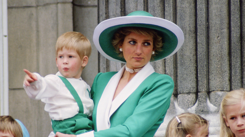 Princess Diana holding Prince Harry during Trooping the Colour