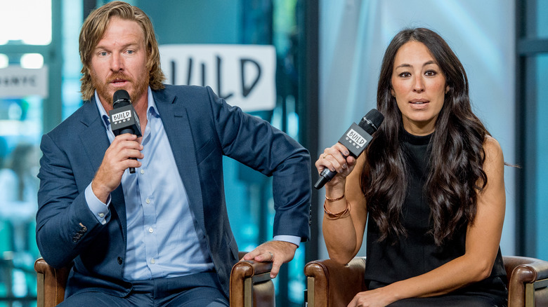 Chip and Joanna Gaines on stage together.