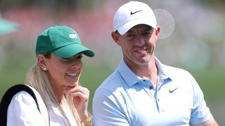 Erica Stoll caddying for Rory McIlroy
