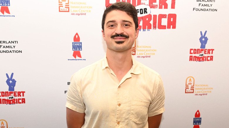 Yuri Sardarov posing in button-down shirt