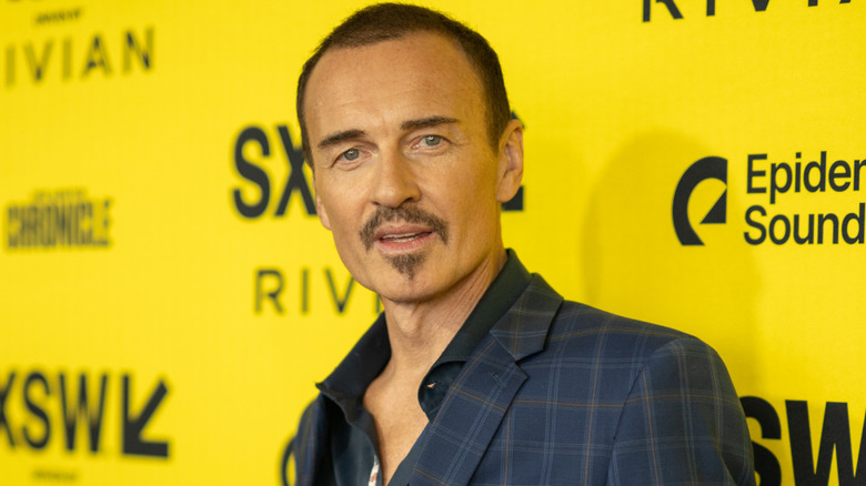 Julian McMahon posing at the premiere of The Surfer at SXSW festival