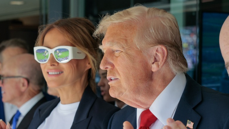 Melania Trump wears sunglasses as Donald Trump squints during the FIFA World Cup
